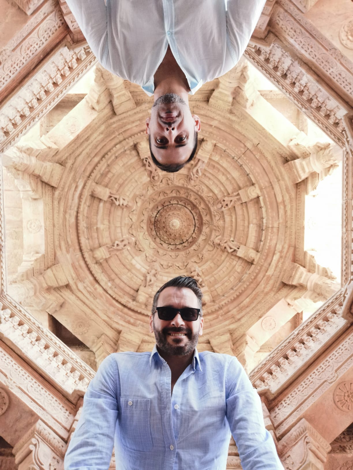Two Gay Tours India travelers beneath ornate Indian architecture