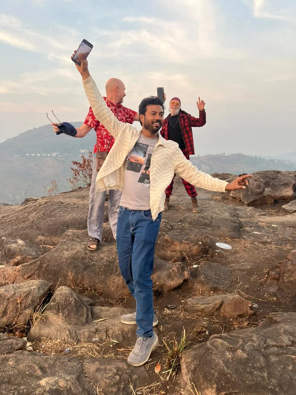 Travelers enjoying a hilltop view