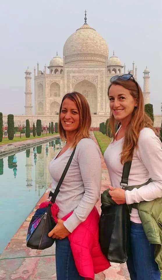 Travelers at the Taj Mahal reflecting pool