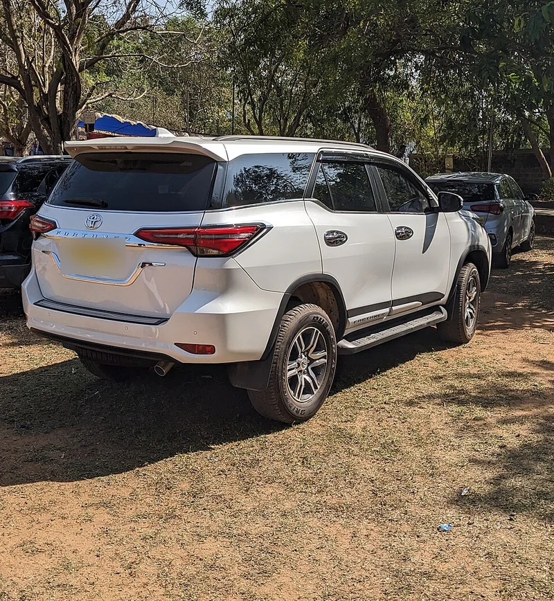 Senior Chauffeur with Toyota Fortuner 4x4